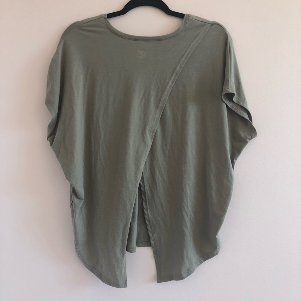 Light green airy yoga top with open back